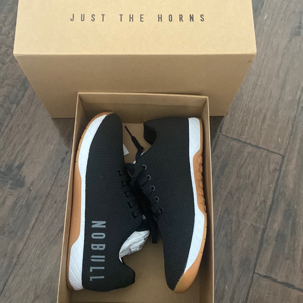 Only tried them on once. Never worn. Black/white/gum color. 11 M size